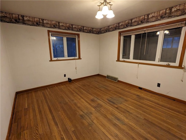 spare room featuring hardwood / wood-style flooring