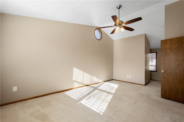 unfurnished living room with light carpet, ceiling fan, and lofted ceiling