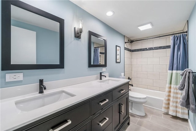 full bathroom with vanity, tile patterned flooring, shower / bathtub combination with curtain, and toilet