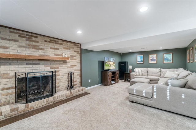 living room with carpet and a brick fireplace