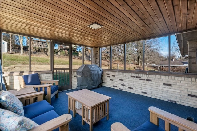 unfurnished sunroom featuring wood ceiling