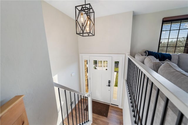 entryway with a chandelier and hardwood / wood-style floors