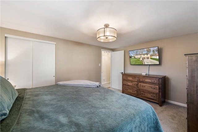 carpeted bedroom with a closet