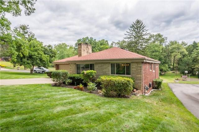 view of side of property featuring a yard