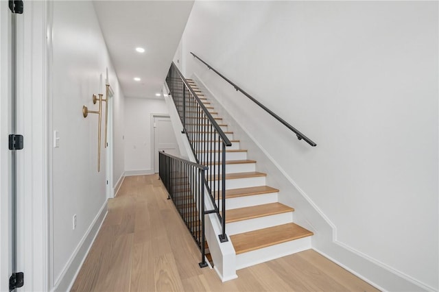 stairway featuring hardwood / wood-style floors