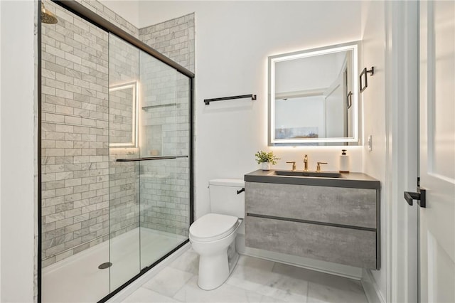 bathroom with an enclosed shower, vanity, and toilet