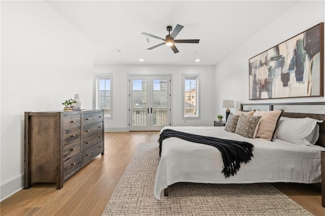 bedroom with ceiling fan, french doors, access to outside, and light hardwood / wood-style flooring