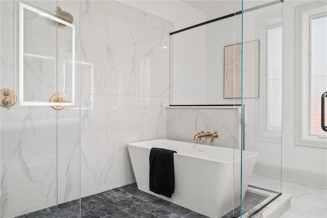 bathroom featuring separate shower and tub