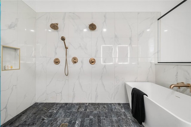 bathroom featuring shower with separate bathtub and tile walls