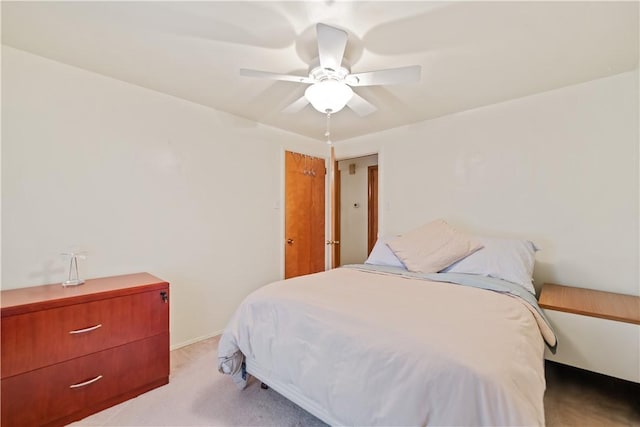 bedroom featuring ceiling fan and light colored carpet