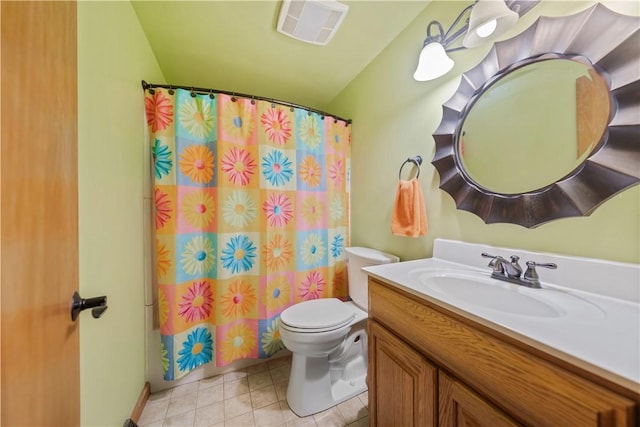 bathroom with vanity, toilet, and walk in shower