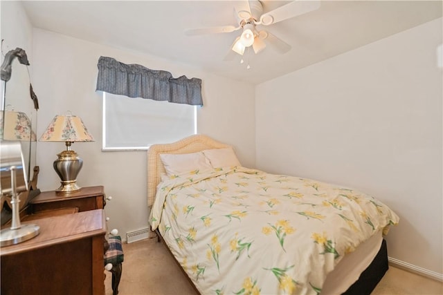 bedroom with carpet flooring, ceiling fan, and baseboard heating