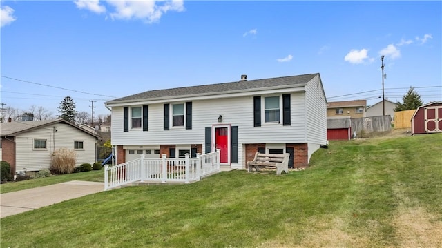 bi-level home with a front lawn