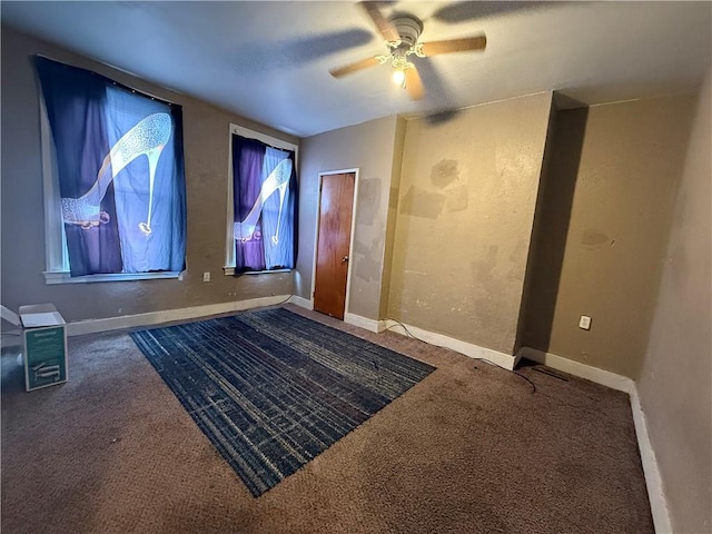 cinema room featuring ceiling fan and carpet floors