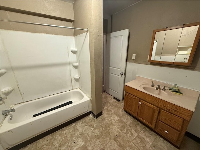 bathroom with washtub / shower combination and vanity