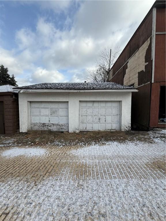 view of snow covered garage