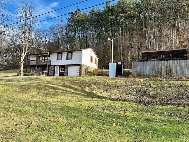 exterior space with a garage and a wooden deck