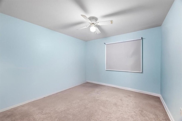 unfurnished room with ceiling fan and light colored carpet