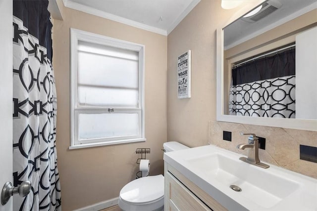 bathroom with backsplash, crown molding, vanity, and toilet