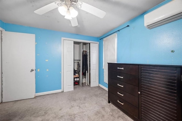 carpeted bedroom featuring a closet, a wall unit AC, and ceiling fan