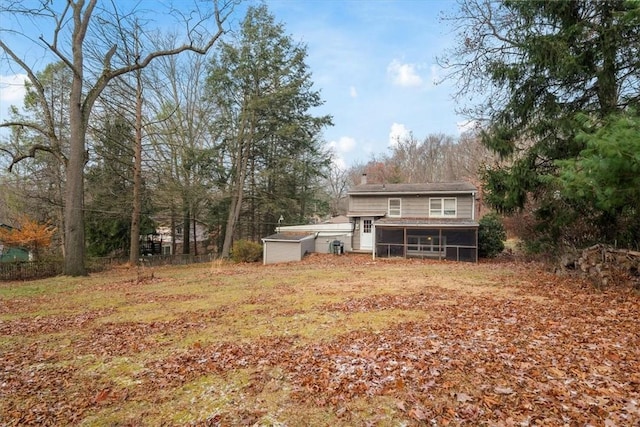 view of yard featuring a sunroom