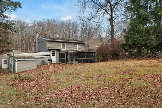 back of property featuring a sunroom