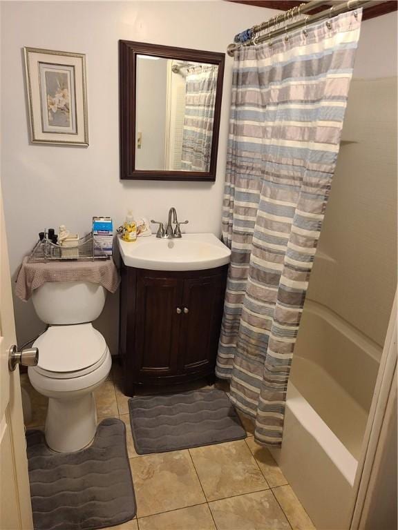 full bathroom with tile patterned flooring, vanity, toilet, and shower / bath combo with shower curtain