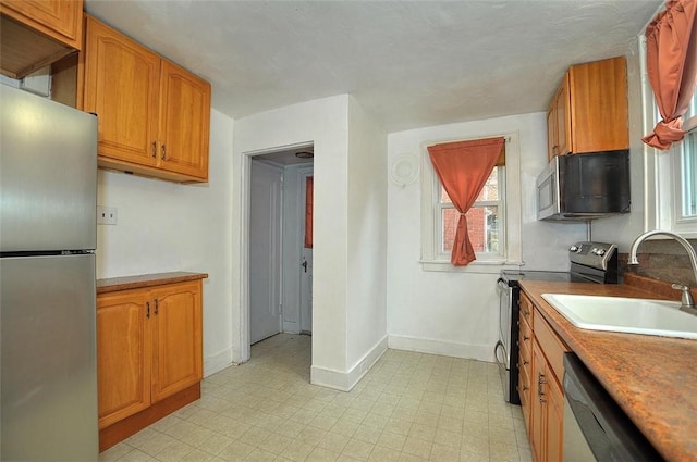 kitchen featuring sink and appliances with stainless steel finishes