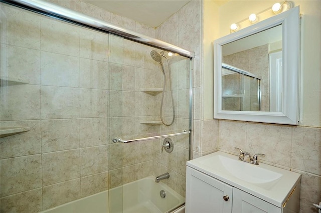 bathroom featuring vanity, tasteful backsplash, tile walls, and enclosed tub / shower combo