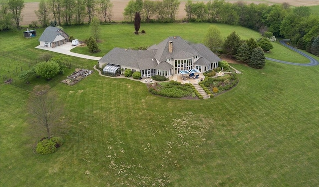 birds eye view of property featuring a rural view