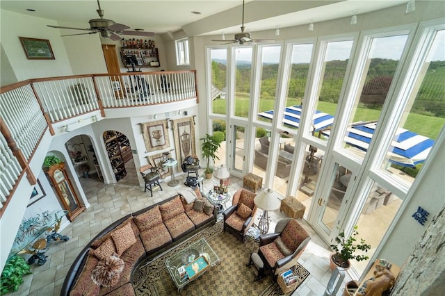 sunroom / solarium with ceiling fan