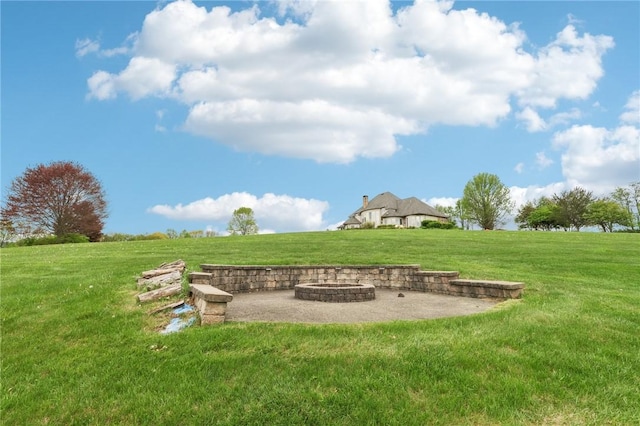 view of yard with a patio, a fire pit, and a rural view