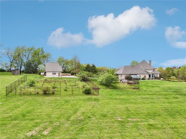 view of yard featuring fence and a rural view