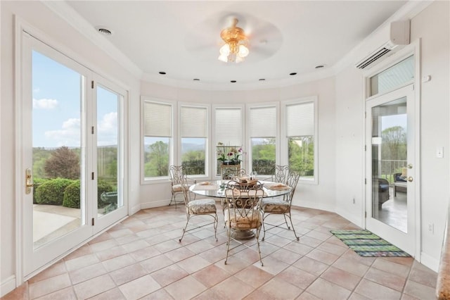 sunroom / solarium with tile patterned floors, a healthy amount of sunlight, french doors, and a wall unit AC