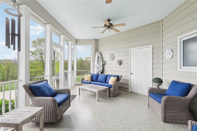 sunroom featuring ceiling fan