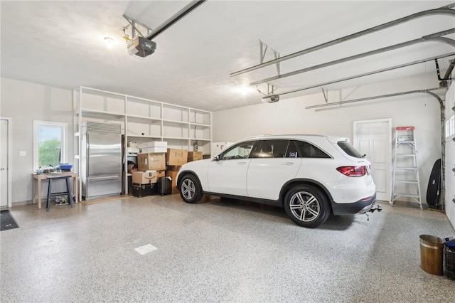 garage featuring a garage door opener and built in refrigerator