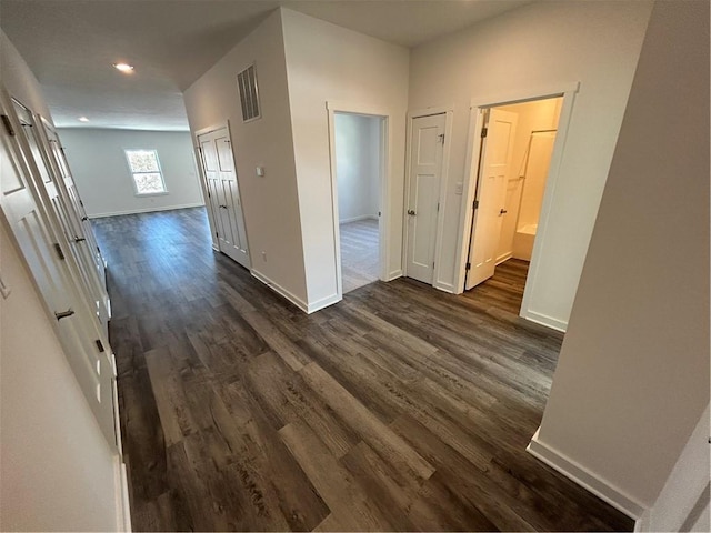 hallway with dark hardwood / wood-style floors