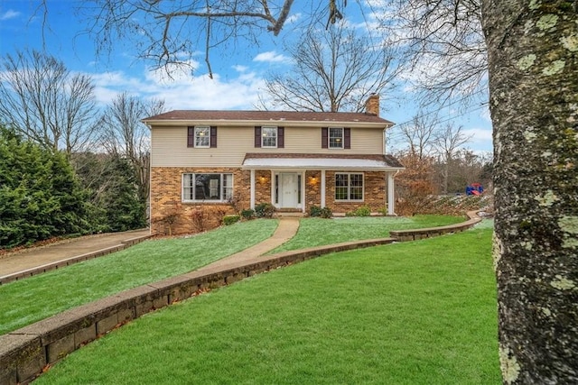 view of front facade featuring a front yard