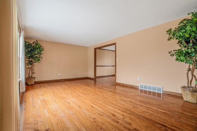 unfurnished room with light hardwood / wood-style floors