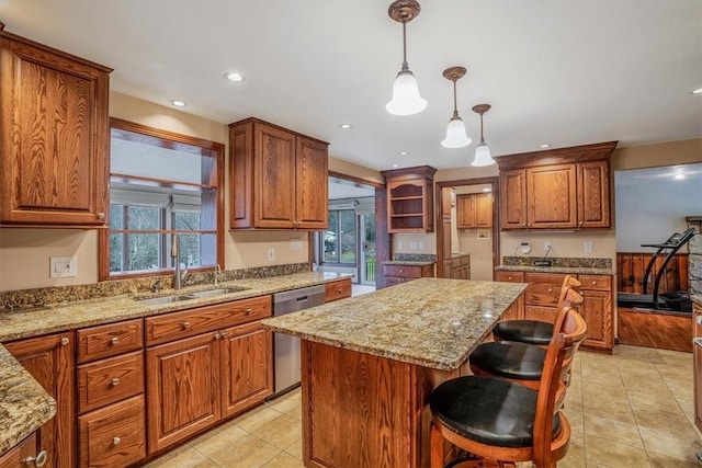 kitchen featuring dishwasher, a center island, plenty of natural light, and sink