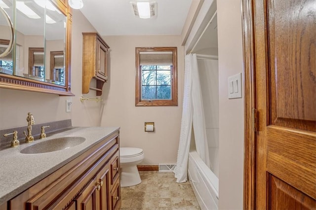 full bathroom with vanity, shower / bath combination with curtain, and toilet