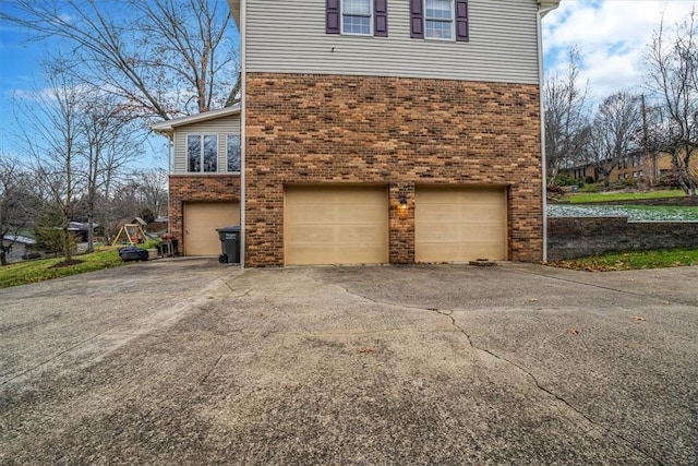 view of side of property with a garage