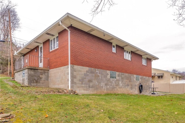 view of home's exterior with a yard