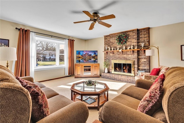 carpeted living room featuring ceiling fan and a fireplace