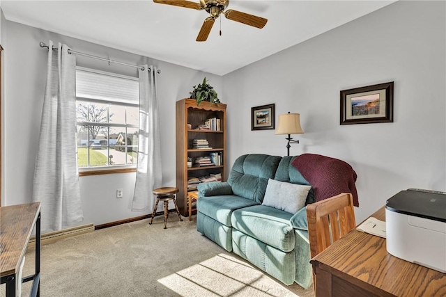 carpeted living room featuring ceiling fan