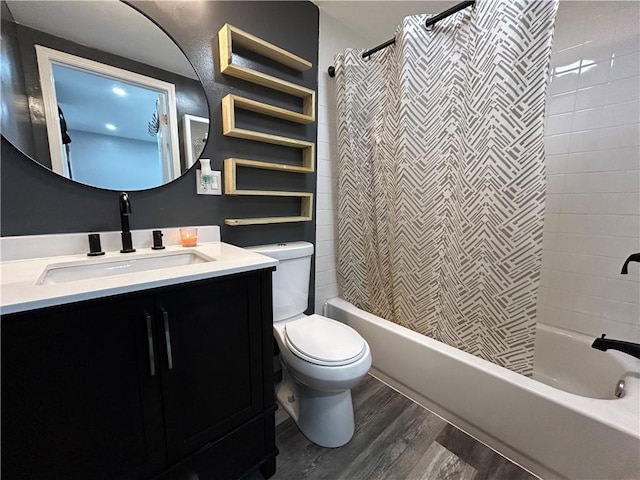 full bathroom with wood-type flooring, vanity, toilet, and shower / bathtub combination with curtain