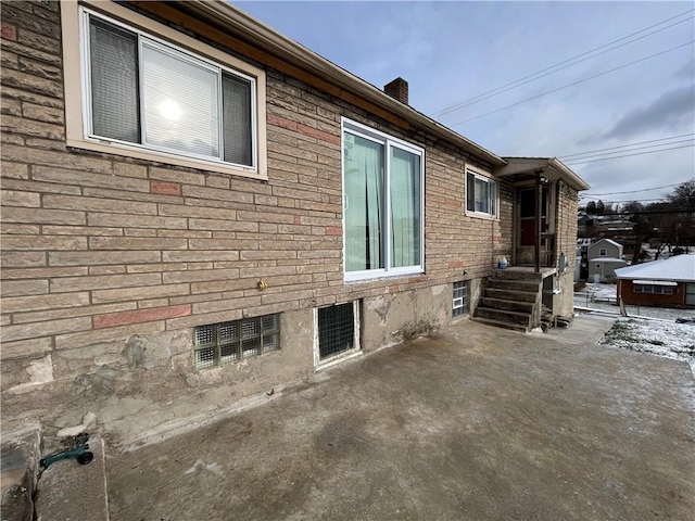 view of side of home with a patio