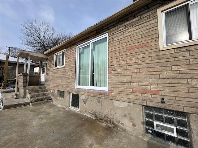 view of side of home featuring a patio area