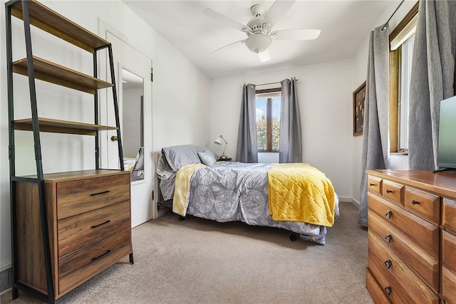 bedroom with a ceiling fan and carpet flooring