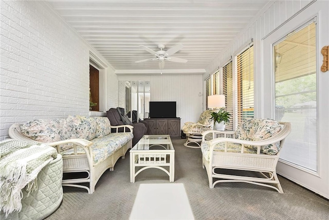 sunroom with a ceiling fan